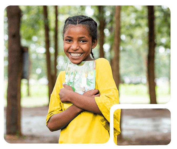 Smiling child with books